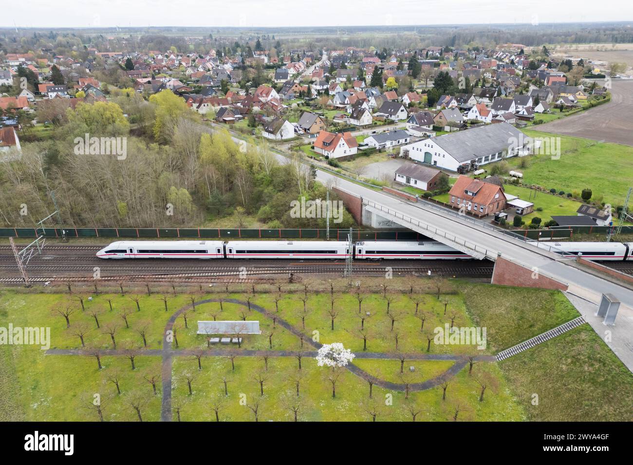 05 April 2024, Lower Saxony, Eschede An ICE train passes the Eschede