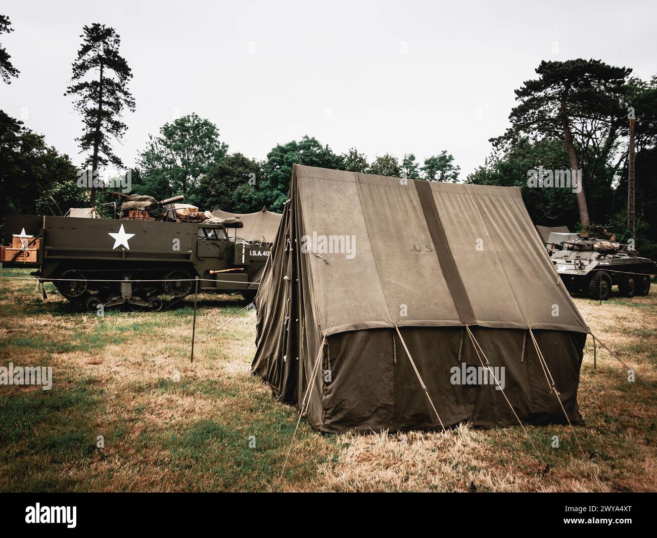 SAINTE MERE L'EGLISE, NORMANDY, FRANCE - JUNE 6 2023. Second world war commemoration. Military camp reconstitution Tents, military american war trucks Stock Photo