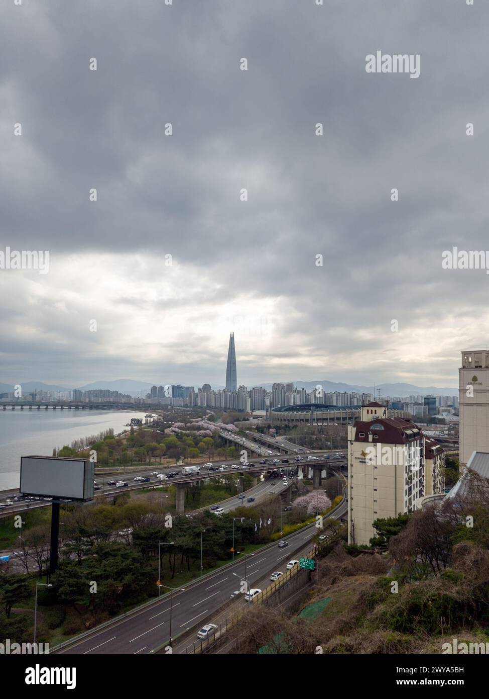 Seoul, South Korea - Olympic Boulevard, Jamsil Olympic Stadium, and Lotte World Tower by the Han River in Seoul. Stock Photo