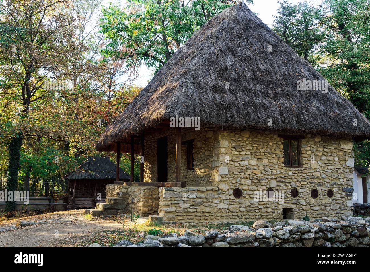 Authentic peasant settlements exhibiting traditional Romanian village life inside Dimitrie Gusti National Village Museum, Bucharest, Romania, Europe C Stock Photo