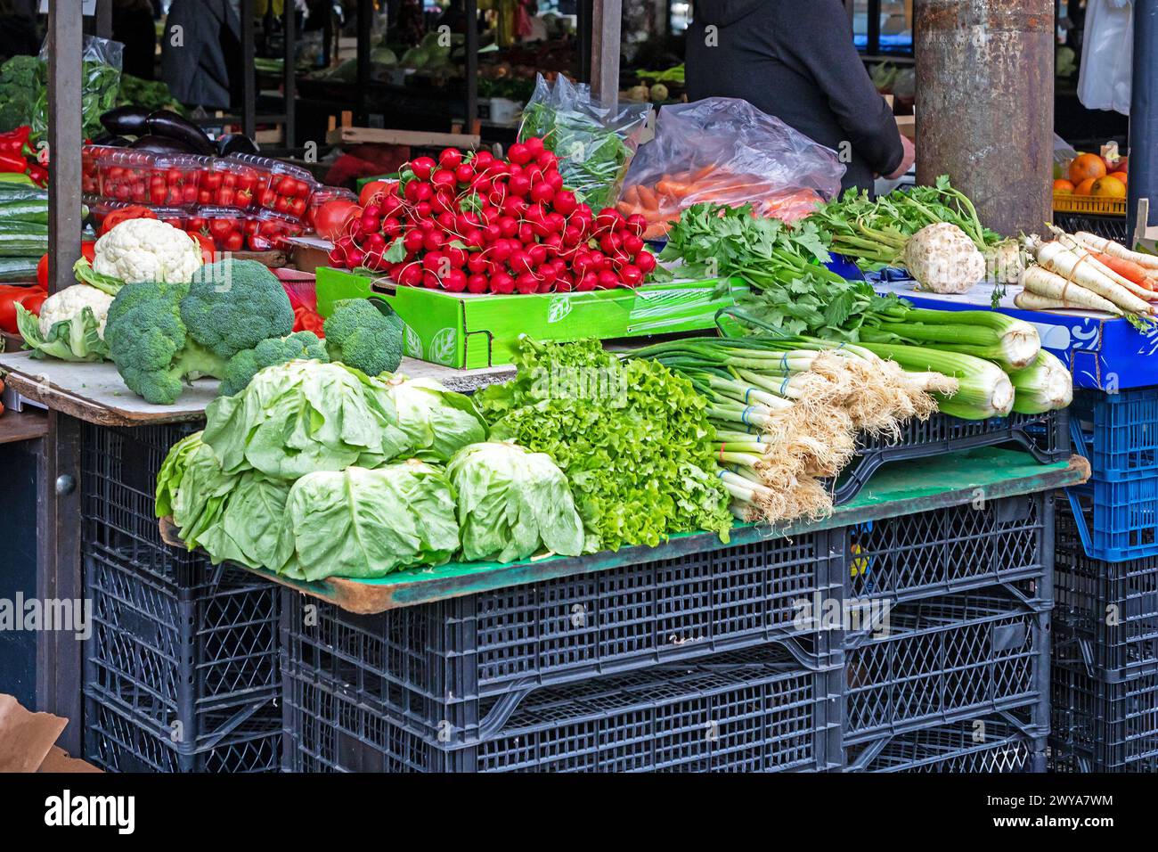 Piles of fresh organic vegetables sold outside on market stall Stock ...
