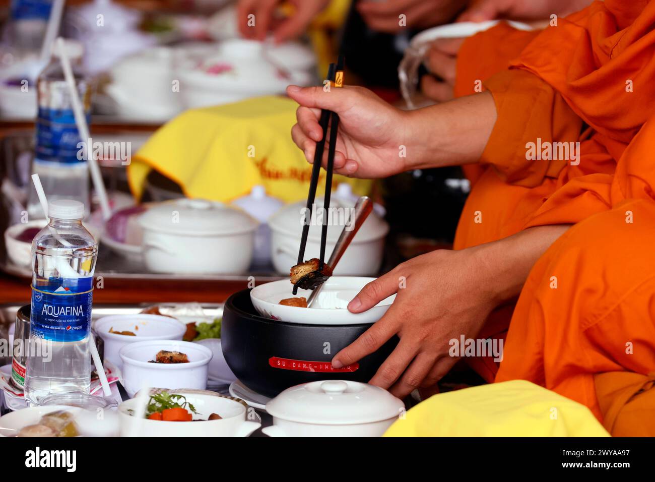 Vegetarian meal, monks at Buddhist ceremony in the main hall, Phuoc Hue