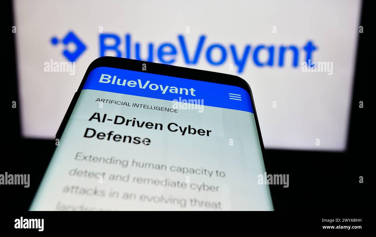 Smartphone with website of US cyber defense platform company BlueVoyant LLC in front of business logo. Focus on top-left of phone display. Stock Photo