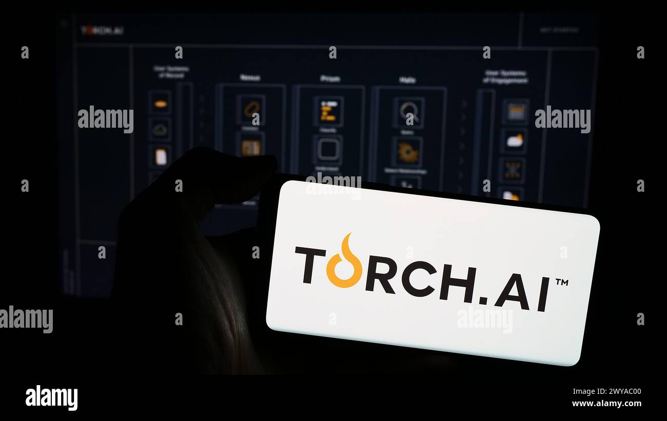 Person holding mobile phone with logo of US artificial intelligence (AI