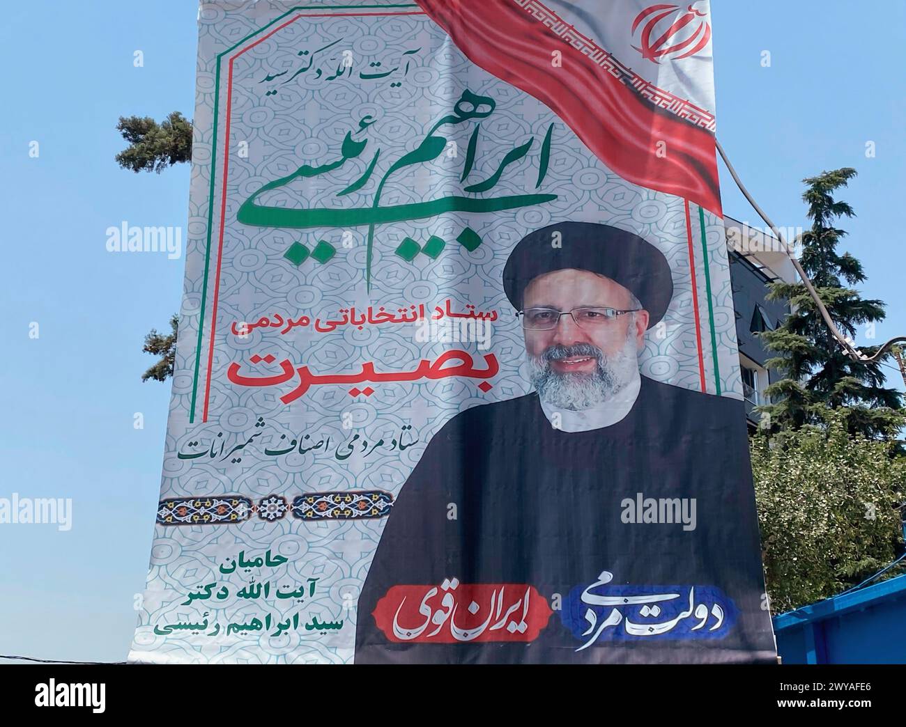 Banner of Ebrahim Raisi before being elected as Iran's President. This round people hit the lowest record in voting for the presidential election. Stock Photo