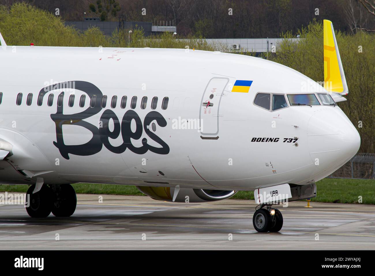 Close-up of an Ukrainian airline's Bees Airline Boeing 737-800 taxiing to runway for takeoff in Lviv Airport Stock Photo
