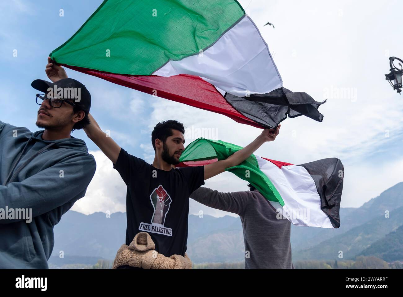 Srinagar, India. 05th Apr, 2024. Kashmiri Muslim men wave Palestinian ...