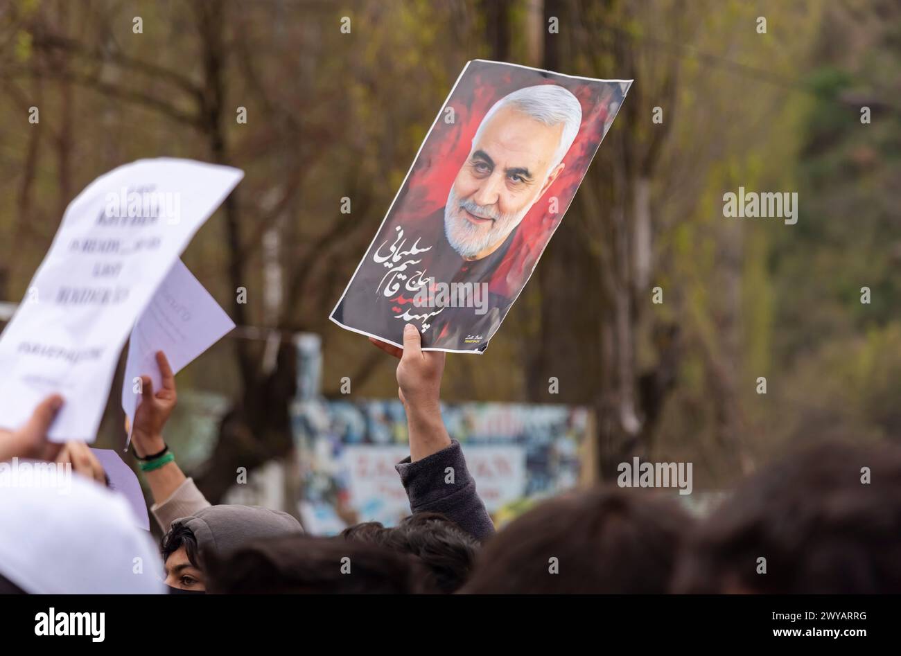 Srinagar, India. 05th Apr, 2024. A Muslim man (not framed) hold a picture of Iranian general Qassim Sulaimani during a Pro-Palestinian rally marking Quds day. (Al-Qud) is the Arabic name For Jerusalem. An initiative started by the late Iranian revolutionary leader Ayatollah Ruhollah Khomeini, Al Quds Day is celebrated globally on the last Friday of the Holy month of Ramadan to show support for Palestinians and condemn Israel. Credit: SOPA Images Limited/Alamy Live News Stock Photo