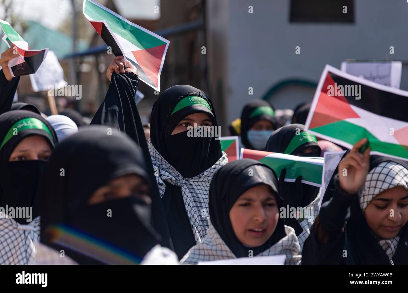 Srinagar, India. 05th Apr, 2024. Kashmiri Muslim women hold posters ...