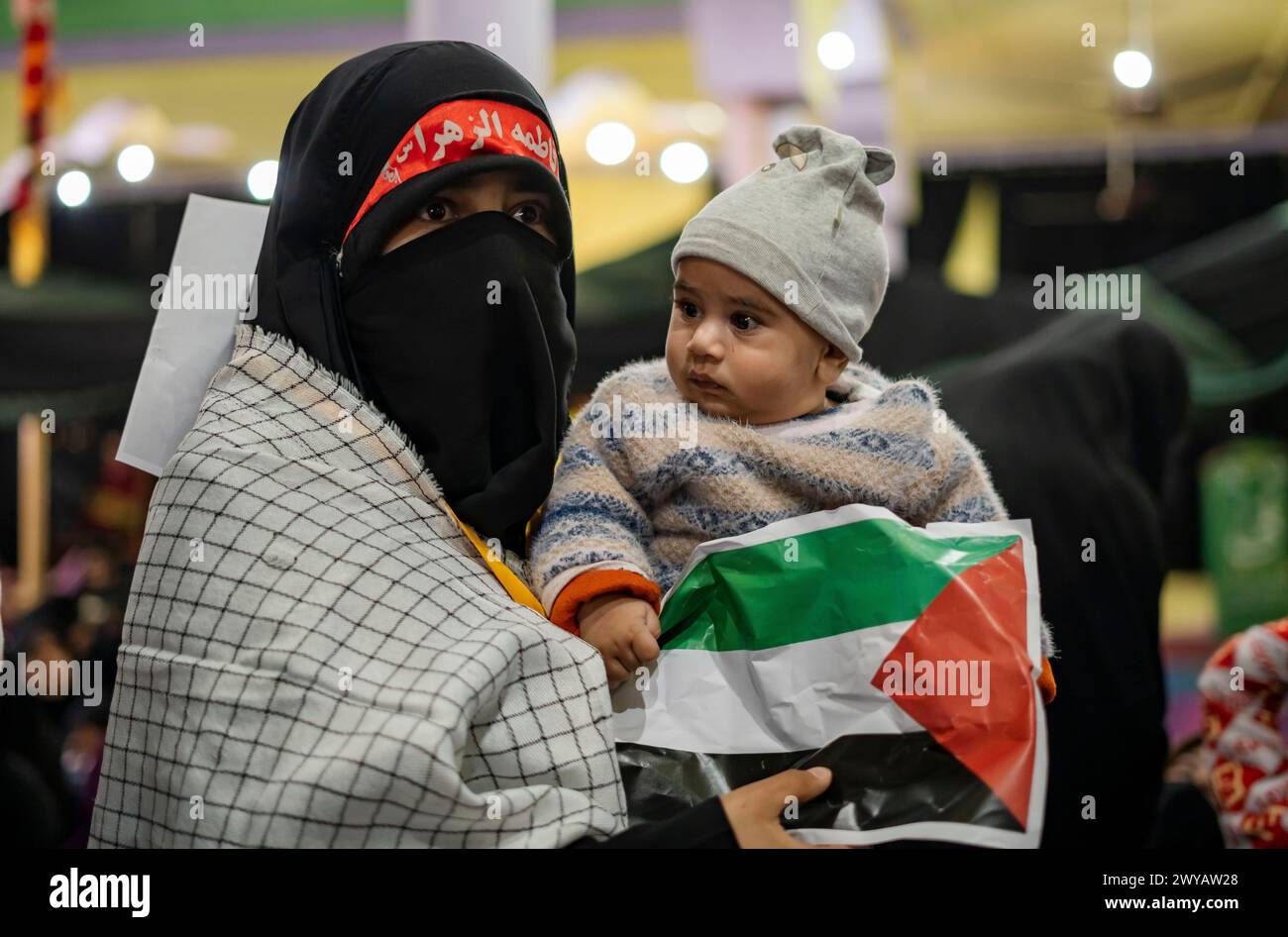 Srinagar, India. 05th Apr, 2024. A burqa clad Muslim woman with her ...