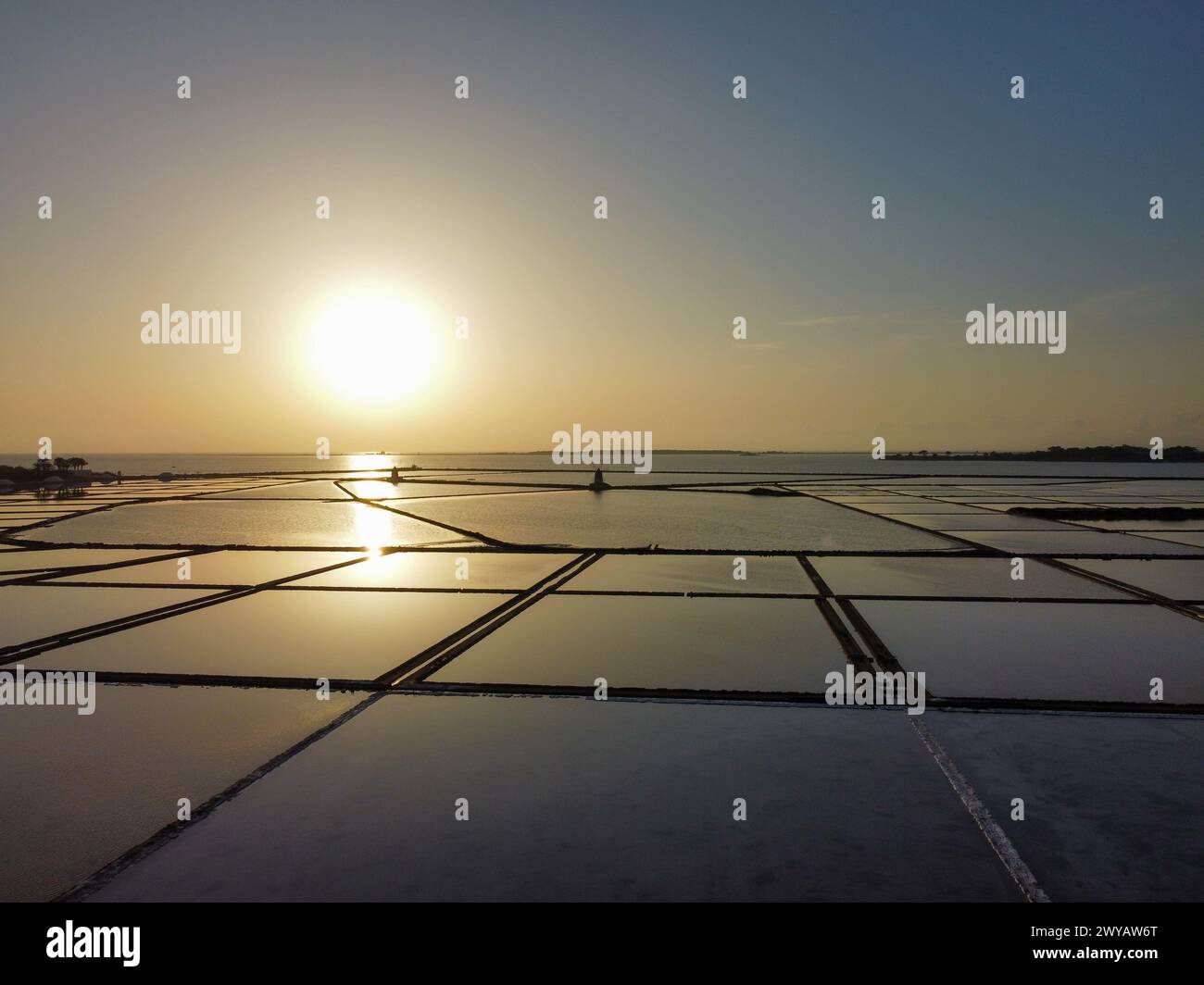 aerial view of the Stagnone salt pans and the ancient windmills at sunset Stock Photo