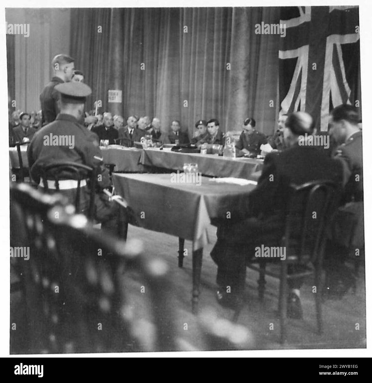 TRIAL OF LIEUTENANT HANS VERNER WANDKE - Original wartime caption: View of the court showing the military board and the prisoner on left. Photographic negative , British Army of the Rhine Stock Photo