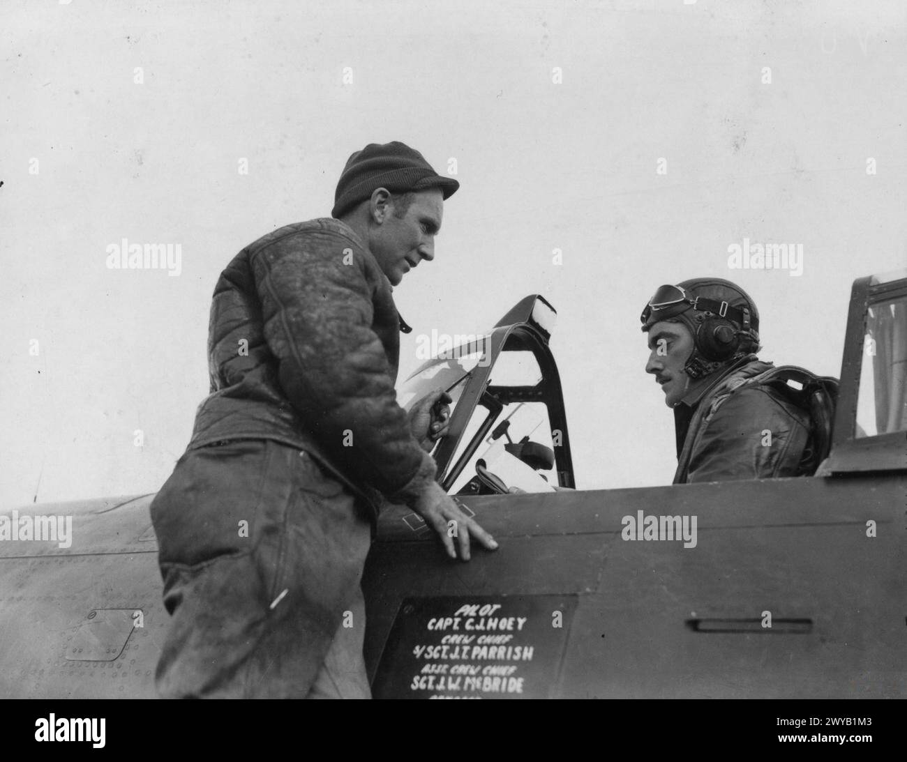 Captain Charles J. Hoey of the 353rd Fighter Group talks with Crew ...