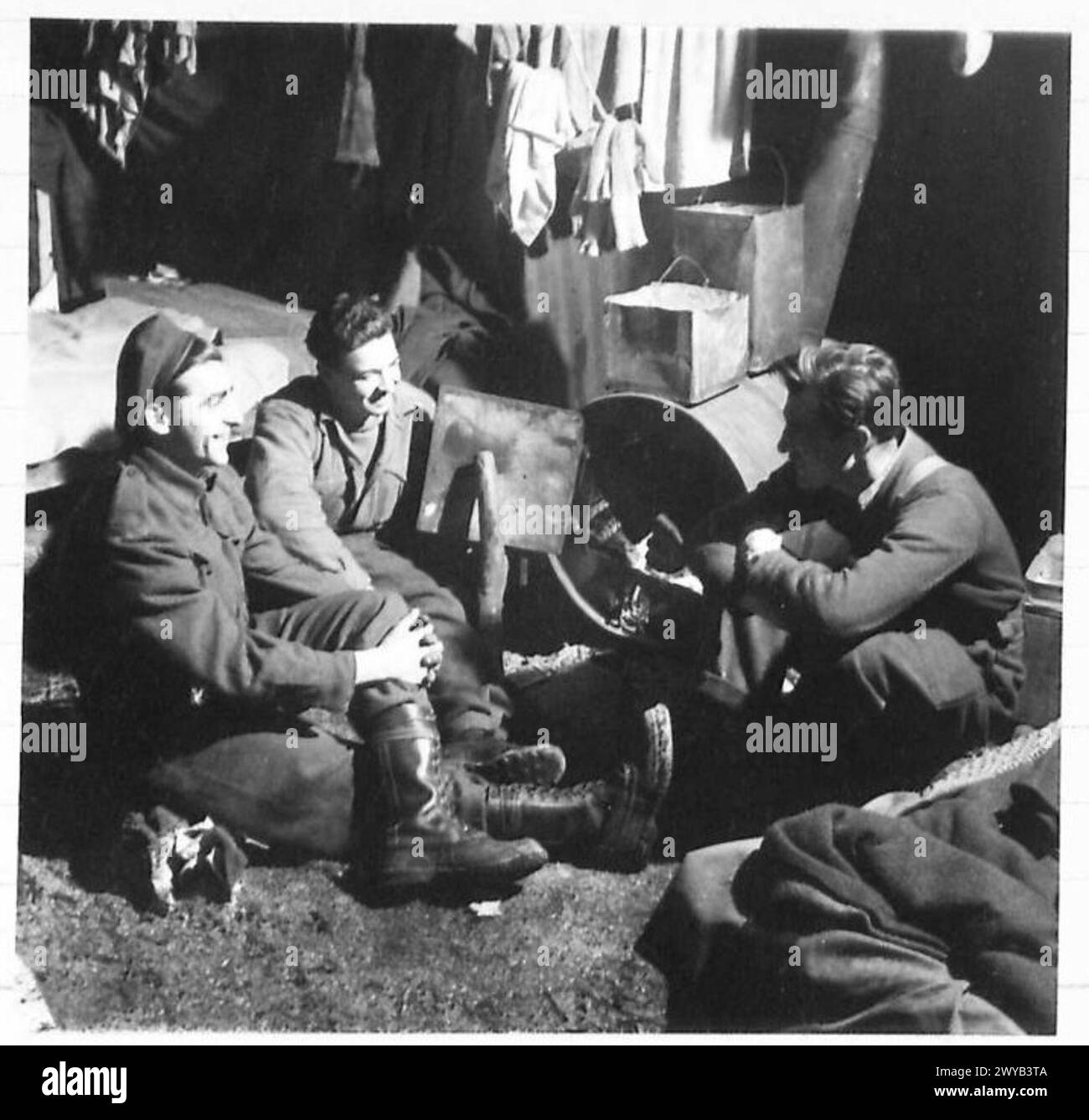 British Army lumberjacks in Holland photographed inside a log cabin ...