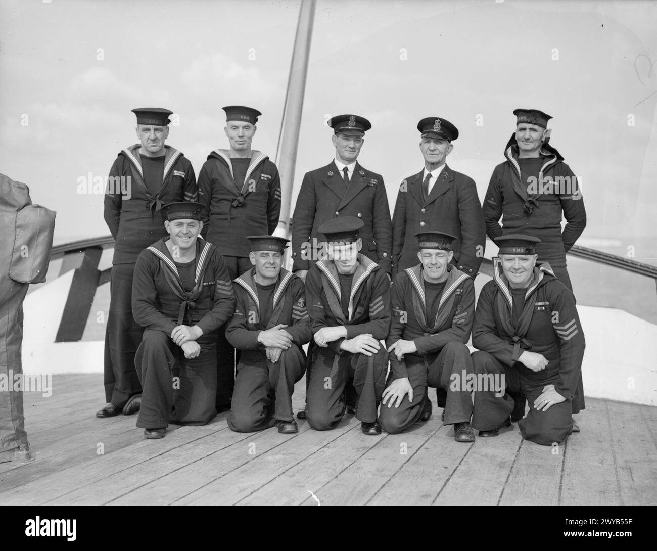 VETERANS OF A VETERAN SHIP. 9 OCTOBER 1944, PORTSMOUTH. A GROUP OF 10 VETERAN SEAMAN SERVING WITH THE TRAINING SHIP HMS IMPLACABLE, WHICH, AS THE FRENCH WARSHIP DUGAY-TROUIN FOUGHT AT TRAFALGAR IN 1805. THEY HAVE A TOTAL SERVICE WITH THE ROYAL NAVY OF 237 YEARS AND THEIR AGES TOTAL 520 YEARS. - Left to right: (front row) AB Charles Morris, DSM, of Haselmere, aged 44 with 30 years service; AB Charles White, of Reading, aged 56, 18 years service; AB G Whittington, of Freshwater, I of W, aged 60, 28 years service; L/S J Cussen, of Southsea, aged 43, 25 years service; AB A Wilson, of Portsmouth, a Stock Photo