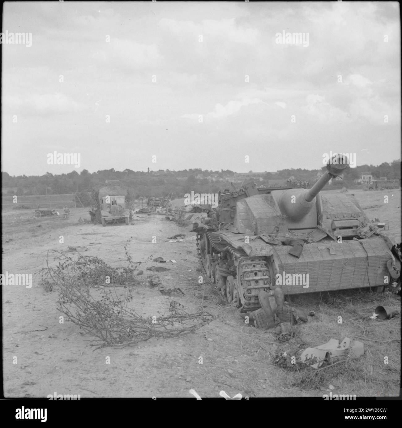 THE BRITISH ARMY IN THE NORMANDY CAMPAIGN 1944 - Knocked-out German StuG III assault gun and soft-skin vehicles shot up by Allied fighter-bombers, 21 August 1944. , Stock Photo