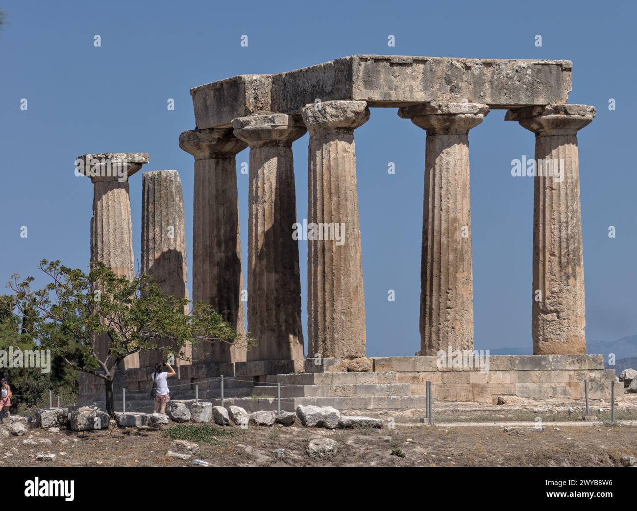 Temple of Apollo ruins in Ancient Corinth, Greece. Details of columns, pillars, doric architecture. Stock Photo