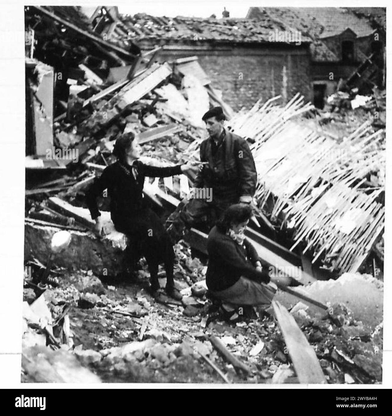 CALAIS RETURNS TO LIFE. Original wartime caption A family look on