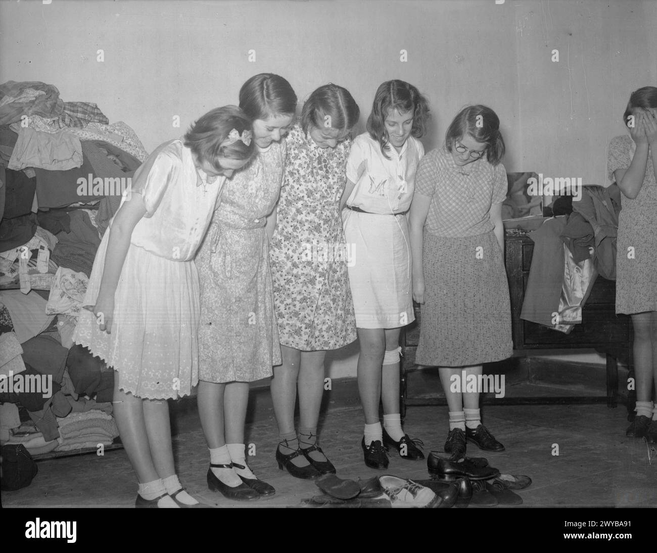 CHANNEL ISLAND EVACUEES TRY ON AMERICAN CLOTHING IN MARPLE, CHESHIRE ...