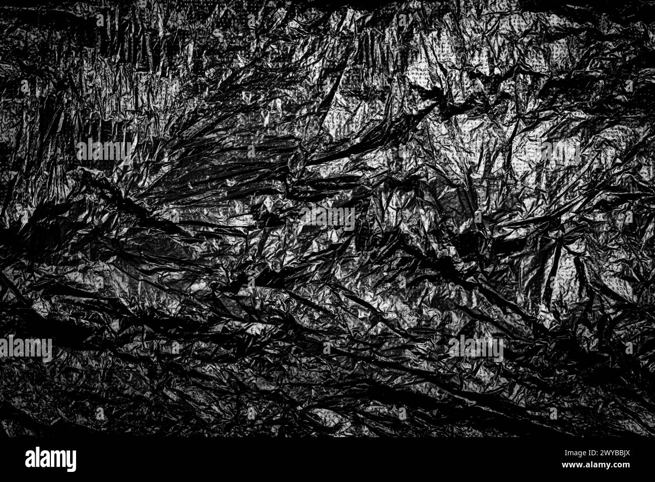 Crumpled black plastic bag Texture Background. Stock Photo