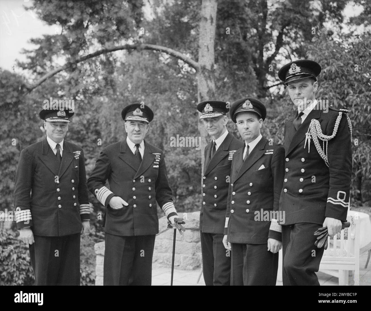 BRITISH NAVAL STAFF IN BERLIN, JULY 1945. - Left to right: Captain G O Maud, DSO, DSC, RN; Admiral Sir Harold Burrough, KCB, KBE, DSO, British Naval C in C Germany; Rear Admiral W E Parry, CB; Captain (S) Ellerton, DSC, RN; and the Flag Lieutenant. , Stock Photo