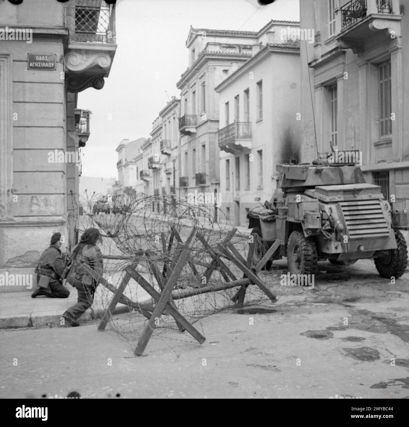A Humber armoured car provides support to British paratroops during ...