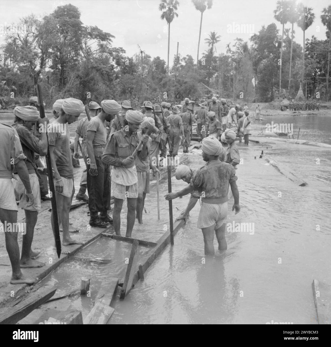 THE CAMPAIGN IN BURMA, APRIL 1945 - Indian engineers construct a wooden ...