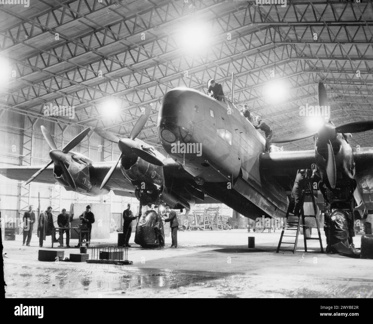 ROYAL AIR FORCE BOMBER COMMAND, 1942-1945. - A Handley Page Halifax B Mark III Series 1A of No. 1663 Heavy Conversion Unit undergoes maintenance at night in a T2 Type hangar at Rufforth, Yorkshire. , Stock Photo