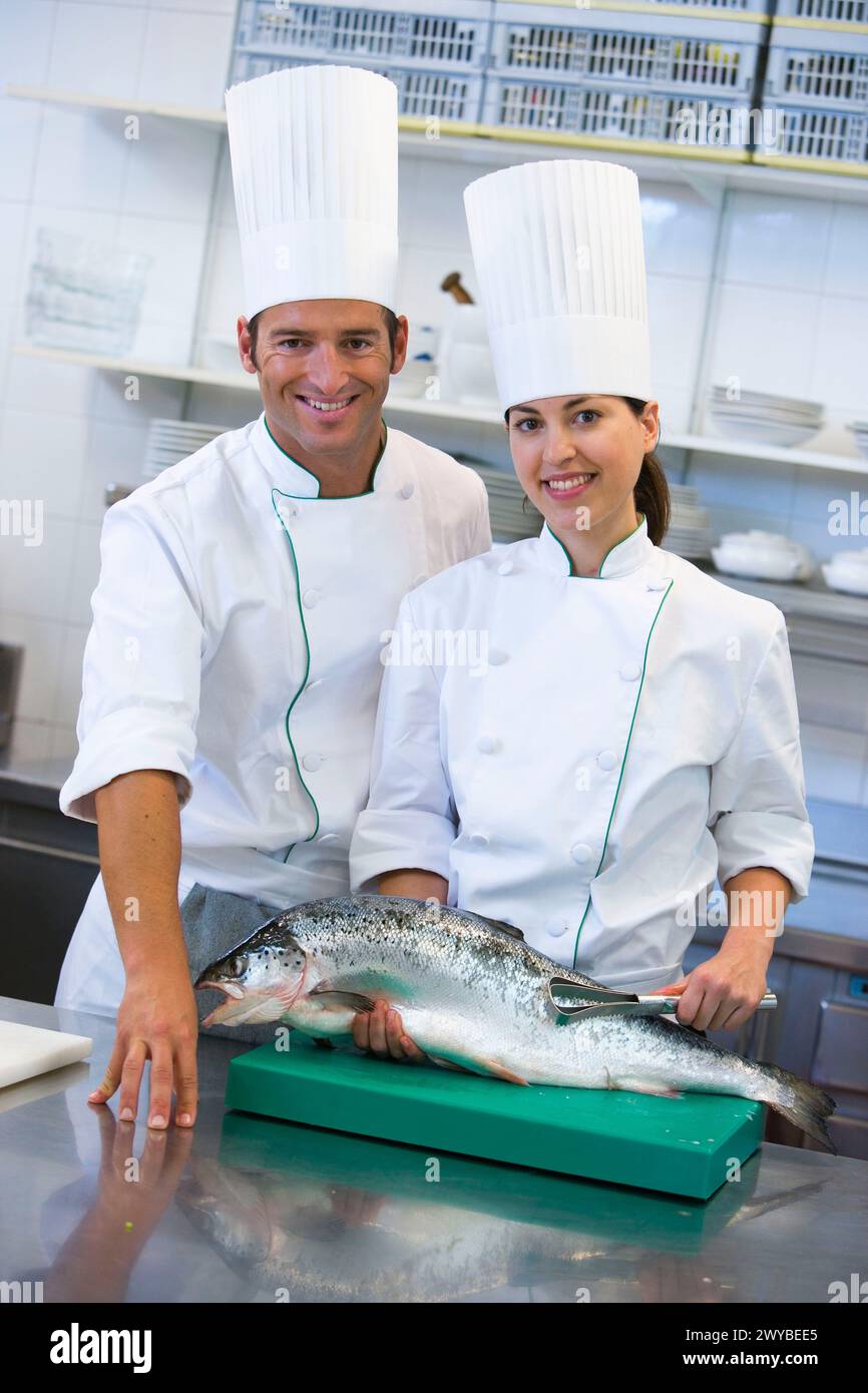 Chefs, salmon. Luis Irizar cooking school. Donostia, Gipuzkoa, Basque Country, Spain. Stock Photo