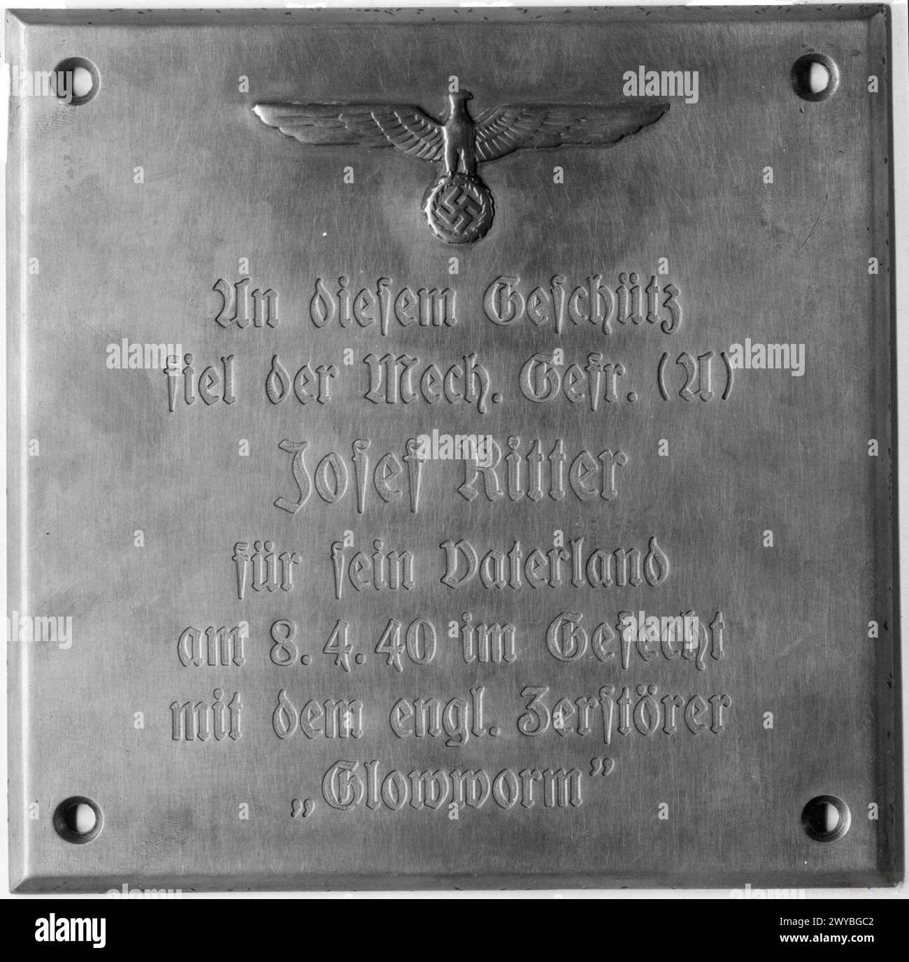 PLAQUE IN ADMIRAL HIPPER RECORDS GLOWWORM'S EPIC FIGHT. 1 JUNE 1945. - Reproduction of the plaque found in the ADMIRAL HIPPER. It reads 'At this gun fell Ord Gunner Josef Ritter (21). Died for his Fatherland on 8.4.40 when engaging the British destroyer GLOWWORM. , Stock Photo