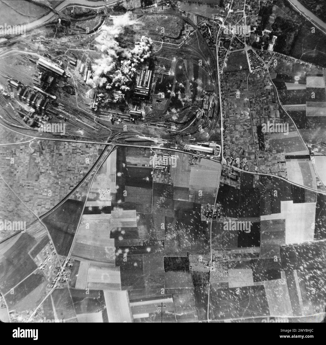 ROYAL AIR FORCE: 2ND TACTICAL AIR FORCE, 1943-1945. - Bombs explode on the Colombelles steel works, east of Caen, during the attack by No. 2 Group on this German strongpoint. 48 North American Mitchells and 24 Douglas Bostons dropped a mixed load of 284 500-lb bombs and 48 1,000-lb bombs on the target. The Orne river can be seen to the right. , Royal Air Force, Group, 226, Royal Air Force, 2 Group, Royal Air Force, Maintenance Unit, 201 Stock Photo