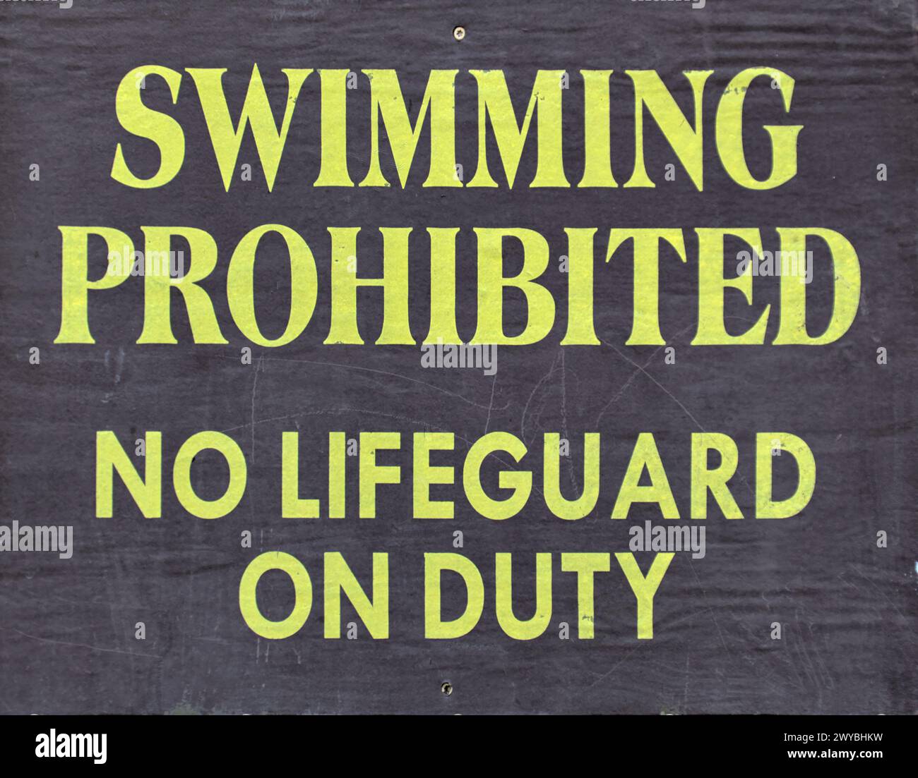 swimming prohibited no lifeguard on duty sign at famous swimming hole (waterfall in ithaca) safety, life guard, drowning threat, water sport, swim, su Stock Photo