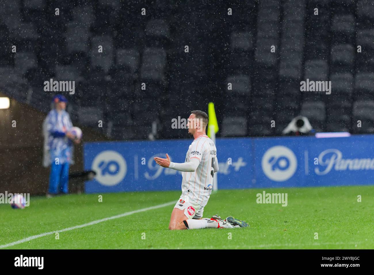 Sydney, Australia. 05th Apr, 2024. Tom Aldred of Brisbane Roar slides on the grass in celebration of a goal during the A-League Men Rd23 match between the Wanderers and Brisbane Roar at CommBank Stadium on April 5, 2024 in Sydney, Australia Credit: IOIO IMAGES/Alamy Live News Stock Photo