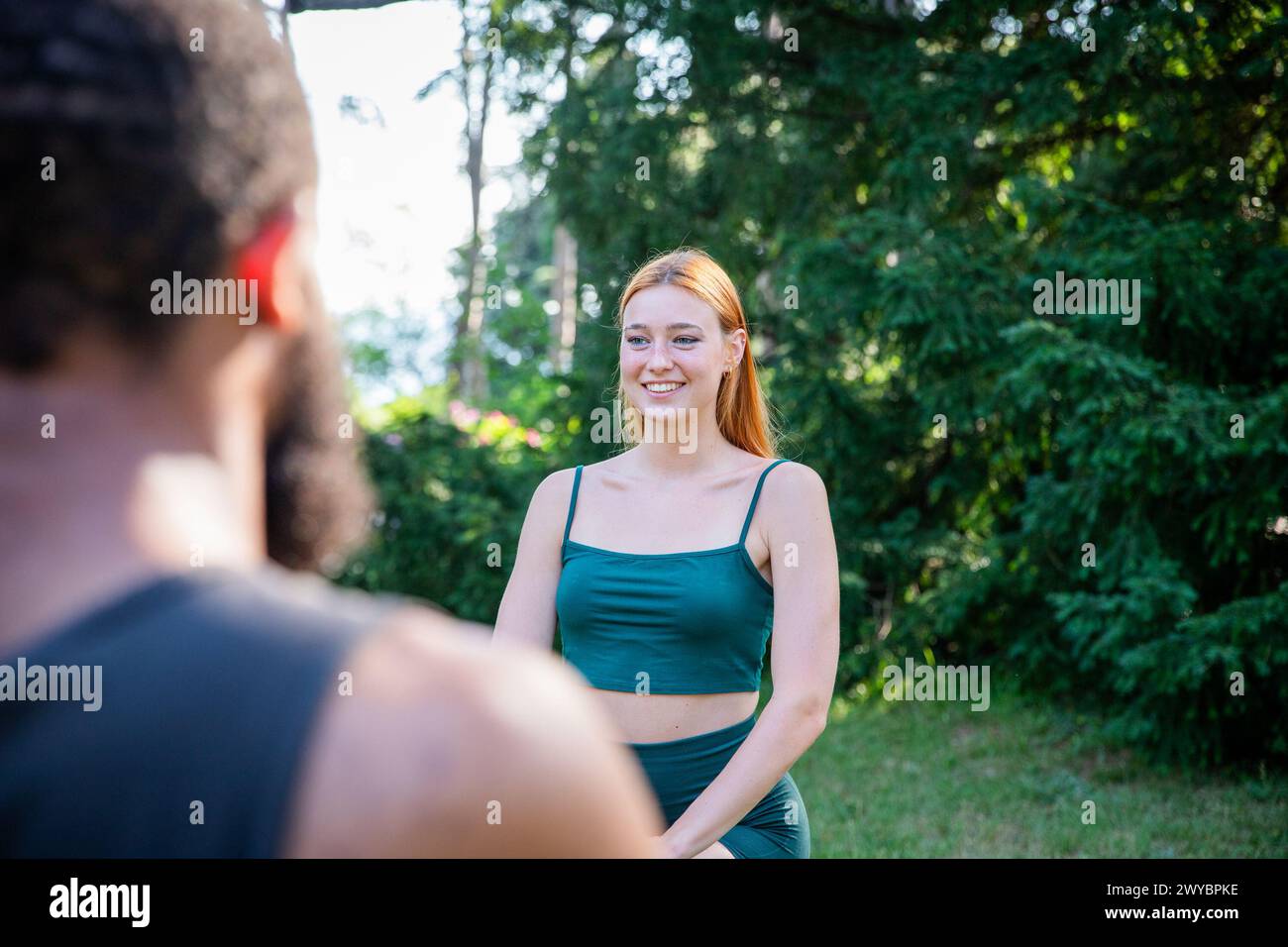 Woman wearing green tank top hi-res stock photography and images - Alamy