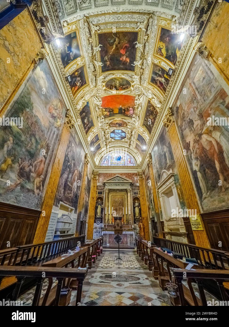 The Capranica chapel is also known as the Chapel of the Rosary. The stucco ceiling was made in 1573 by Marcello Venusti. The chapel contains the tomb of Cardinal Domenico Capranica by Andrea Bregno - Basilica di Santa Maria sopra Minerva - Rome, Italy Stock Photo