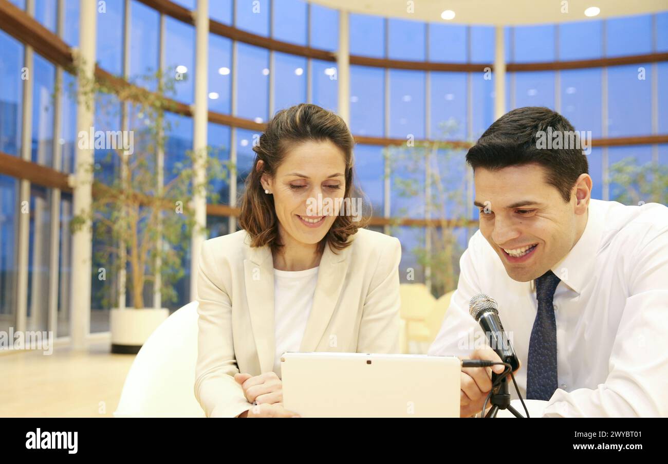 Executives with digital tablet, video conference. Stock Photo