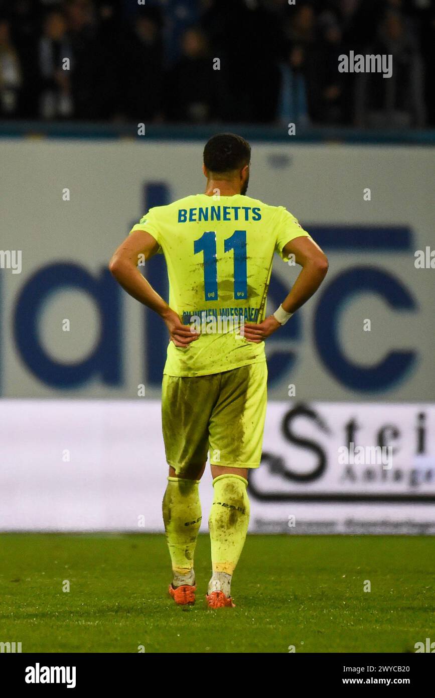 Rostock, Germany. 05th Apr, 2024. Soccer: Bundesliga 2, Hansa Rostock - SV Wehen Wiesbaden, Matchday 28, Ostseestadion. Wiesbaden's Keanan Bennetts walks across the pitch after the 3:1 defeat. Credit: Gregor Fischer/dpa - IMPORTANT NOTE: In accordance with the regulations of the DFL German Football League and the DFB German Football Association, it is prohibited to utilize or have utilized photographs taken in the stadium and/or of the match in the form of sequential images and/or video-like photo series./dpa/Alamy Live News Stock Photo