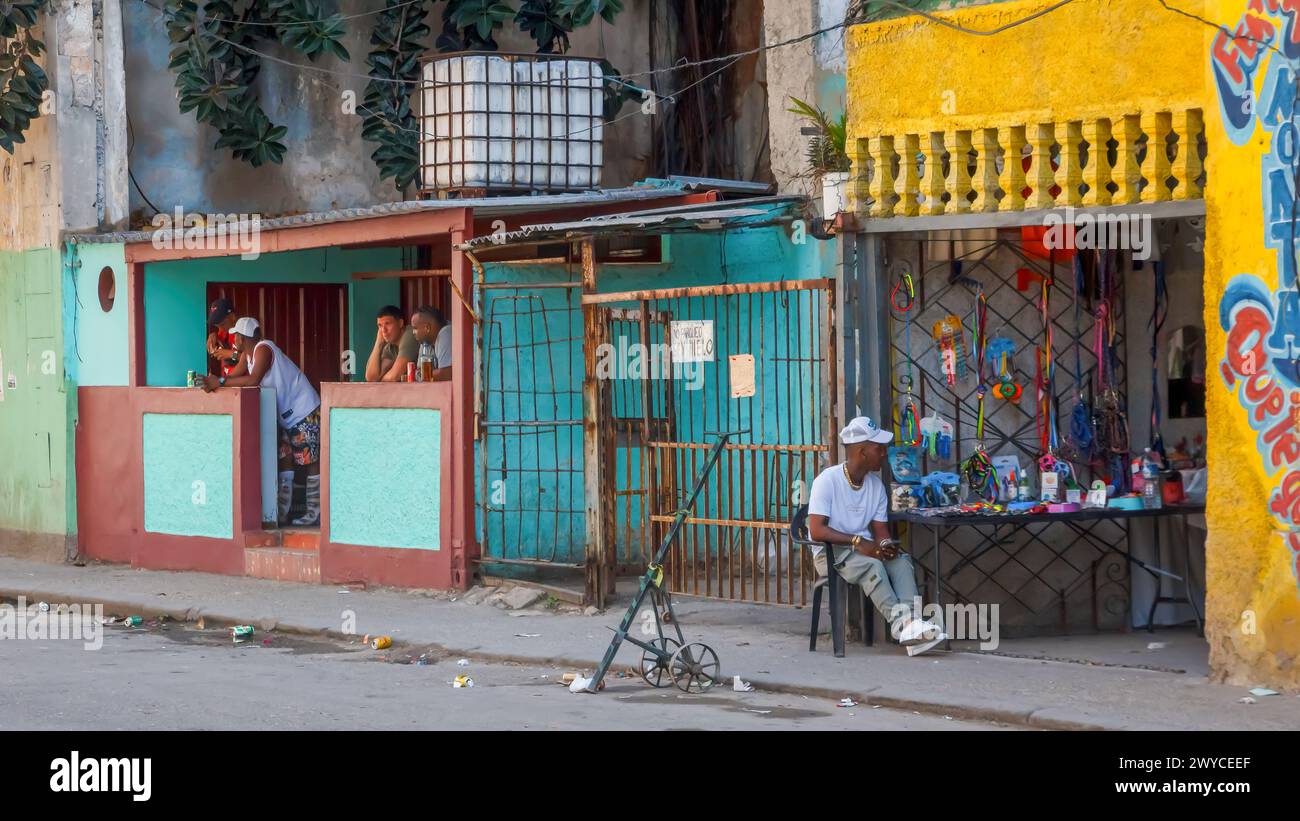Cuban man selling merchandise on a small business in Havana, Cuba Stock Photo