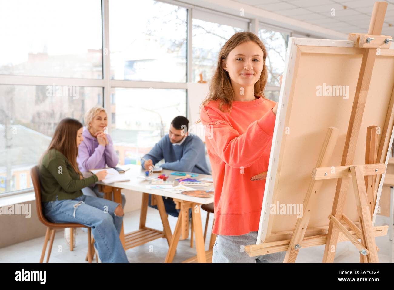 Female student painting on canvas in art school Stock Photo - Alamy