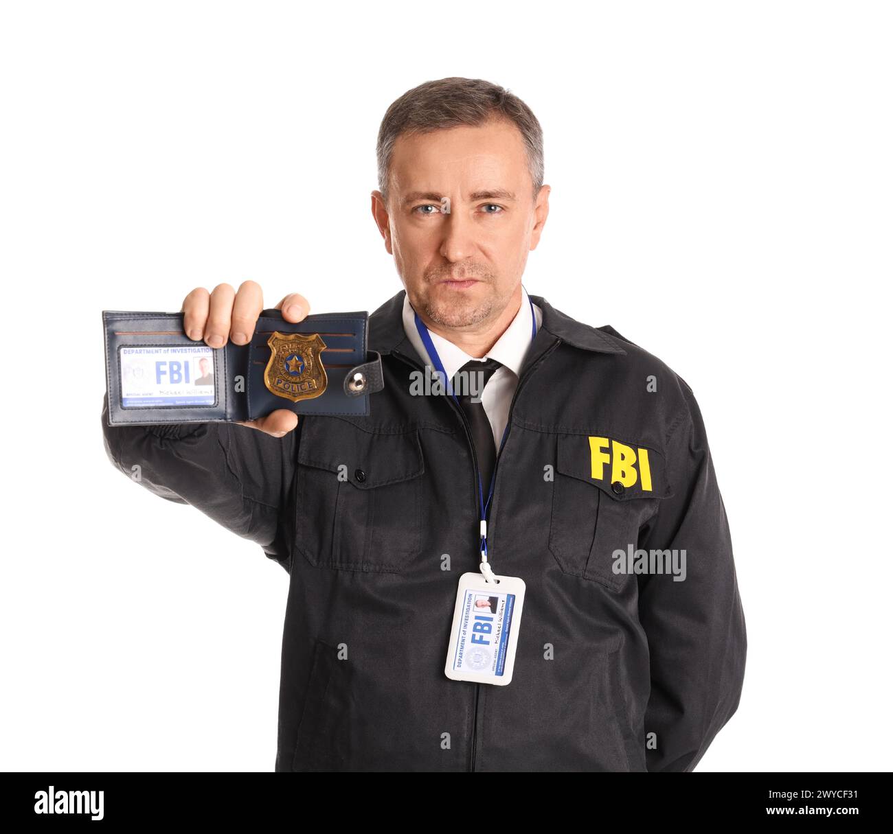Mature FBI agent showing document on white background Stock Photo