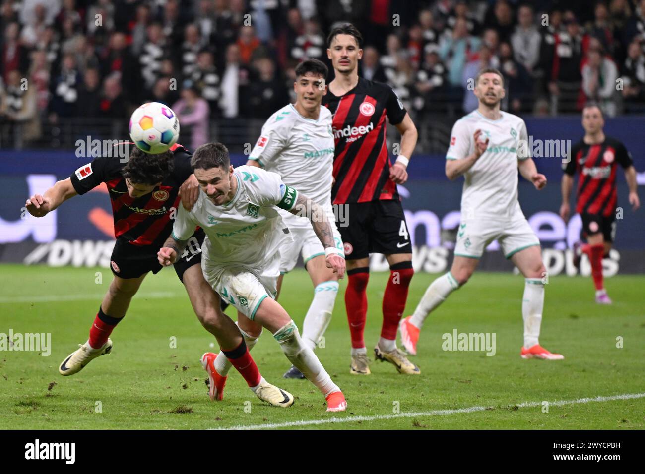 05 April 2024, Hesse, Frankfurt/Main: Soccer: Bundesliga, Eintracht Frankfurt - SV Werder Bremen, Matchday 28, Deutsche Bank Park. Frankfurt's Nacho Ferri (l) and Bremen's Marco Friedl in a header duel. IMPORTANT NOTE: In accordance with the regulations of the DFL German Football League and the DFB German Football Association, it is prohibited to use or have used photographs taken in the stadium and/or of the match in the form of sequential images and/or video-like photo series. Photo: Arne Dedert/dpa Credit: dpa picture alliance/Alamy Live News Stock Photo