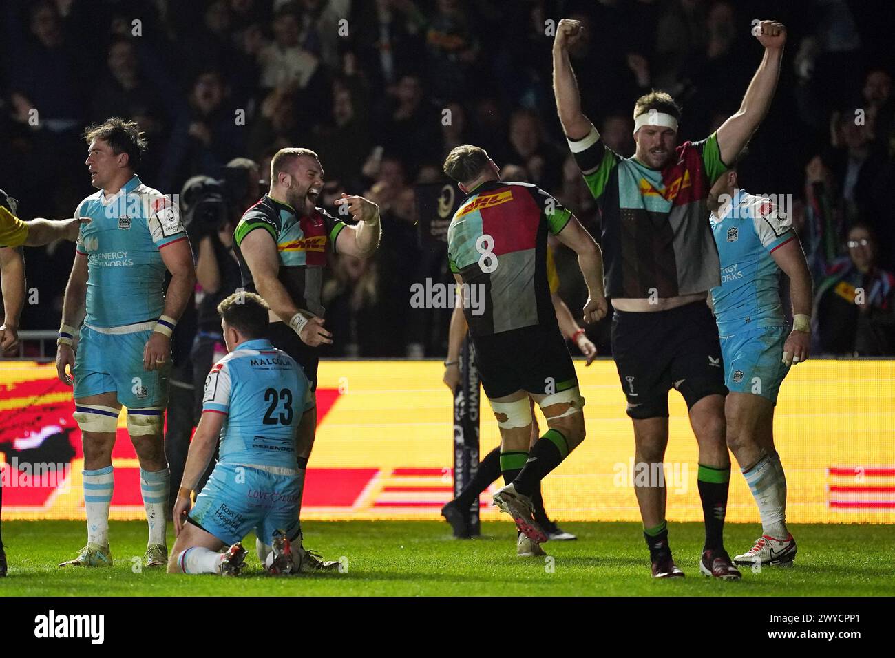 Harlequins' Tyrone Green and Alex Dombrandt (centre) celebrate after Sam Riley scores a try during the Investec Champions Cup Round of 16 match at Twickenham Stoop, London. Picture date: Friday April 5, 2024. Stock Photo