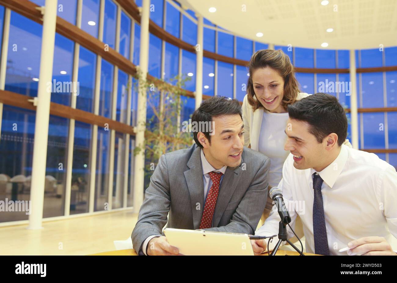 Executives with digital tablet, video conference. Stock Photo