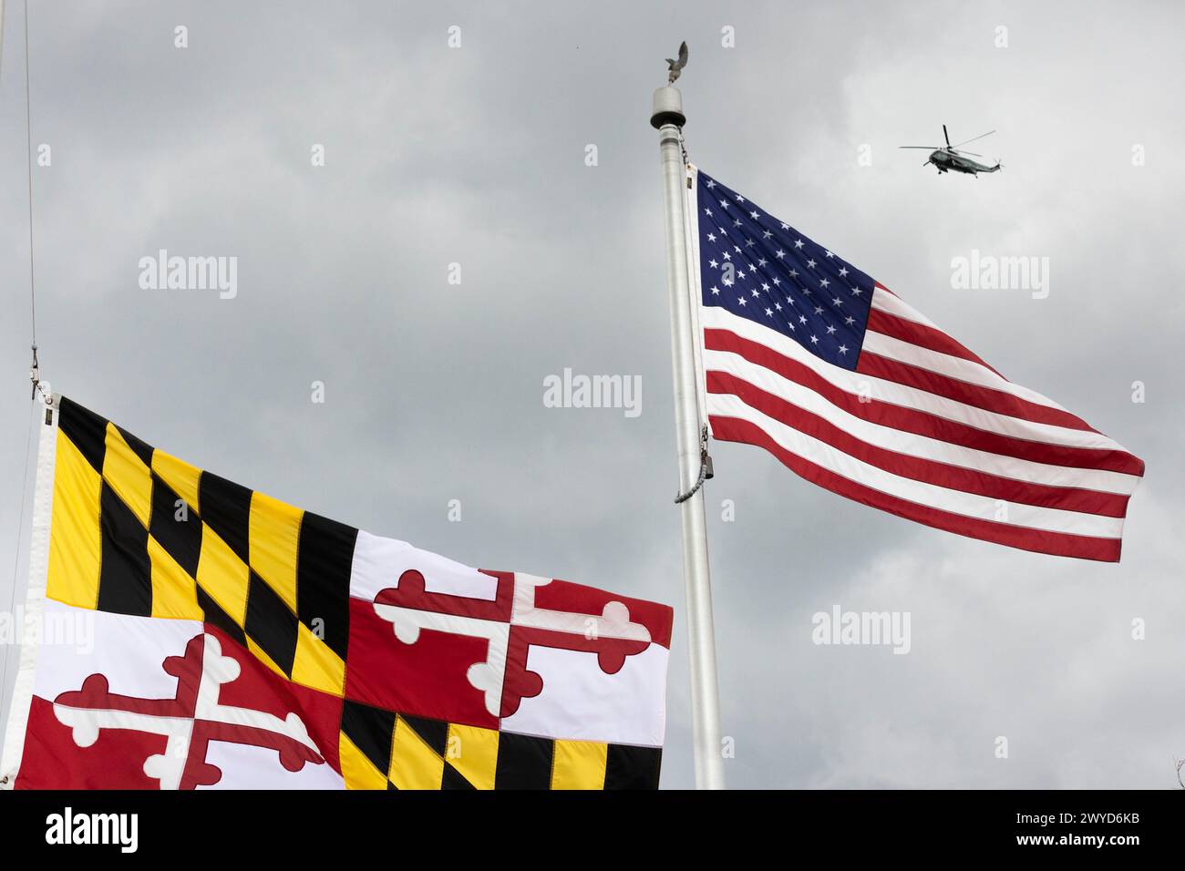 Baltimore, United States. 05th Apr, 2024. A Marine One helicopter is seen behind the Maryland state flag and the United States flag as President Biden arrives in Baltimore to visit the site of the Key Bridge collapse at the Maryland Transportation Authority Police headquarters on Friday, April 5, 2024 in Baltimore, MD. (Photo by Wesley Lapointe/Sipa USA) Credit: Sipa USA/Alamy Live News Stock Photo