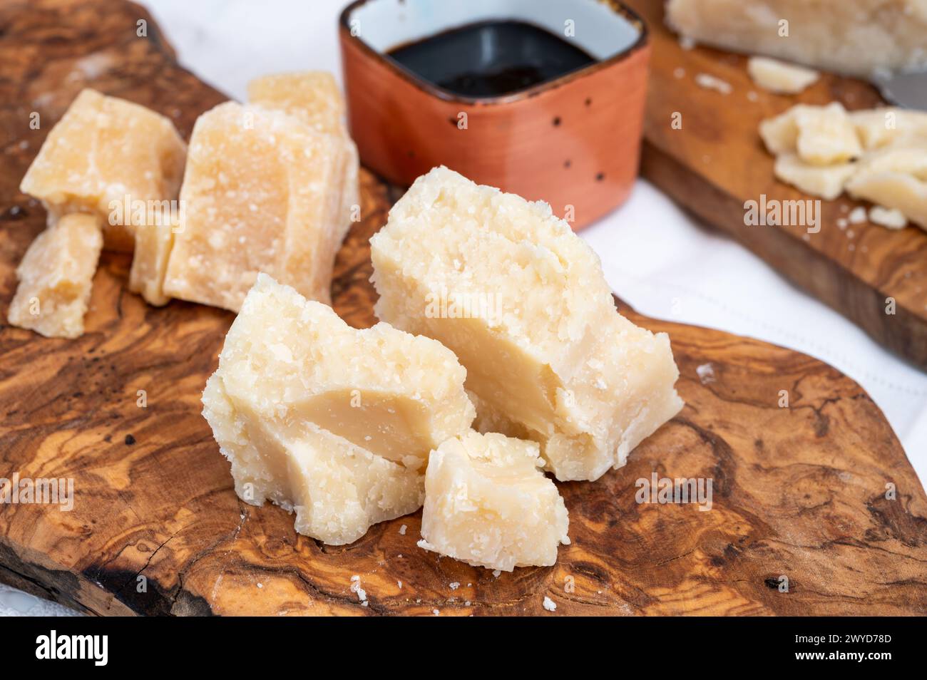 Tasting of 24 and 48 months aged in caves Italian parmesan hard cheese ...