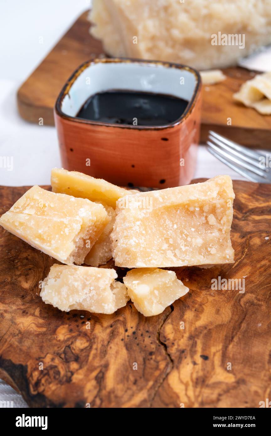 Tasting of 24 and 48 months aged in caves Italian parmesan hard cheese