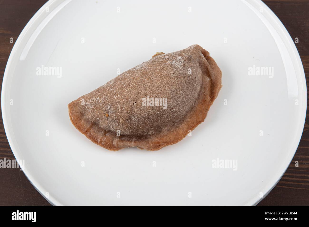 Leek pastry made from buckwheat flour. Homemade savory hand pies