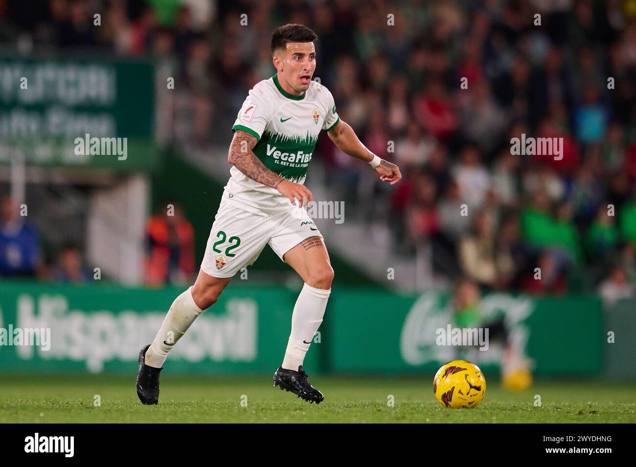 ELCHE, SPAIN - APRIL 5: Nico Fernandez Left-Back of Elche CF runs with the ball during the LaLiga Hypermotion match between Elche CF and Real Oviedo at Manuel Martinez Valero Stadium, on April 5, 2024 in Elche, Spain. (Photo By Francisco Macia/Photo Players Images) Stock Photo