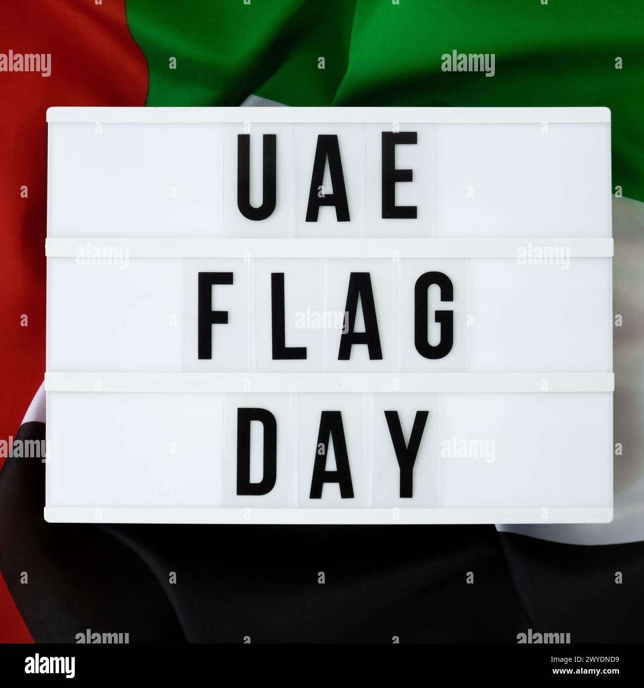 Message with text UAE FLAG DAY on United Arab Emirates waving flag made ...