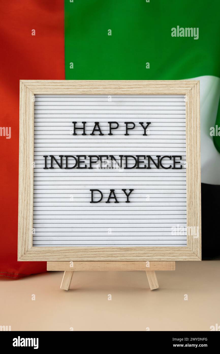HAPPY INDEPENDENCE DAY text frame on United Arab Emirates waving flag ...